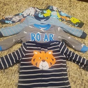 4 pair of Carter's footed pajamas